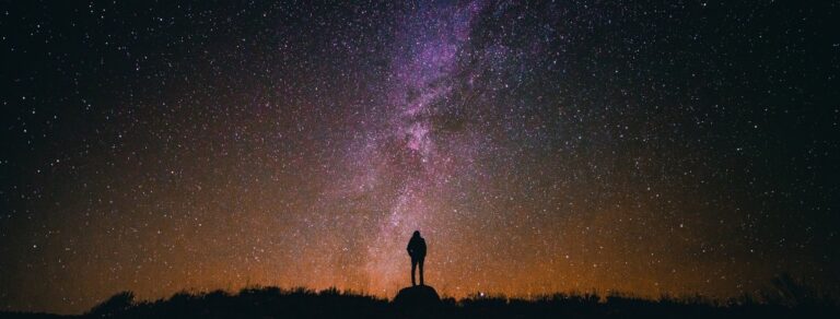 person standing under the milky way 1